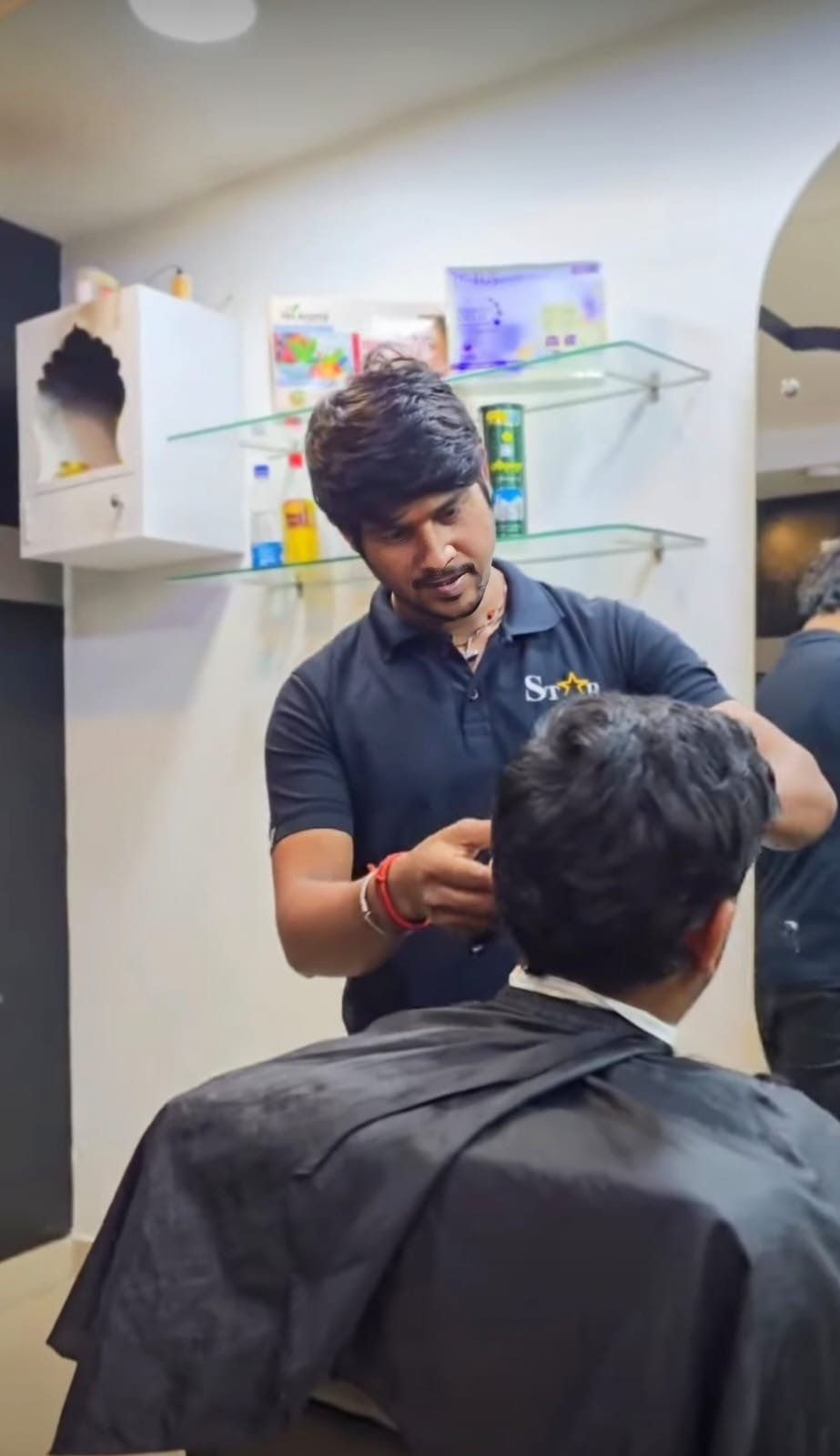 Men's haircut in progress at STAR Men's Professional Salon